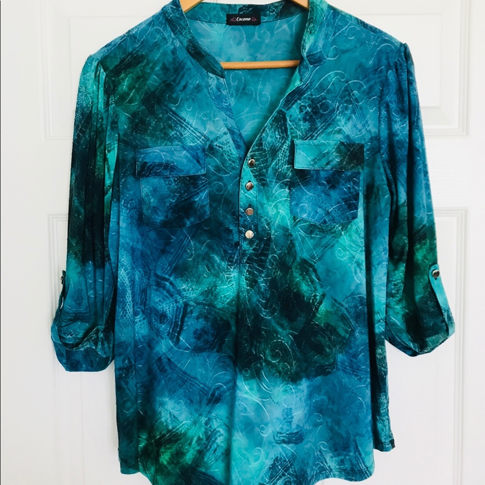 Fun top with button up sleeves. Size M.